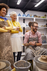 Happy group of people on handmade pottery making workshop. Creative, hobby ,workshop  concept