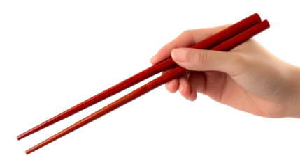 Close up of an Asian hand holding red chopsticks with subtle wood grain texture, perfect for Asian cuisine and dining promotions