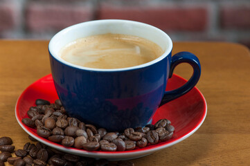Blue Coffee Cup with Latte on Red Saucer