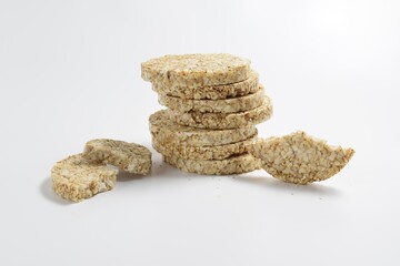 A pile of healthy buckwheat crispbread on a light background