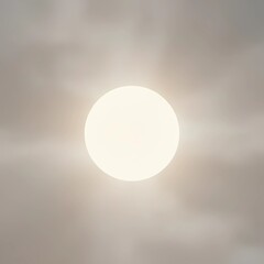 Bright sun shining through clouds in a clear sky  