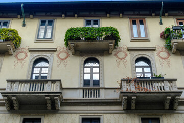 Old residential buildings along Via Bernardino Telesio in Milan, Italy