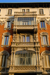 Old residential buildings along Via Ariosto in Milan, Italy