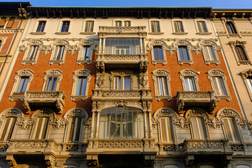 Old residential buildings along Via Ariosto in Milan, Italy