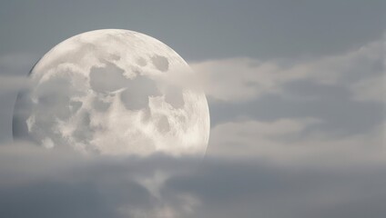 Ethereal Moonscape - A Full Moon Veiled in Soft Clouds.