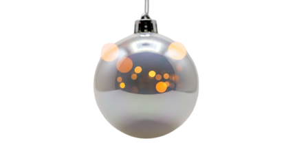 Silver Christmas bauble with warm bokeh lights reflected on black background Christmas ornament