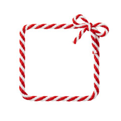 Rectangle frame made of Christmas red and white string rope with decorative bow, isolated on white and PNG transparent background