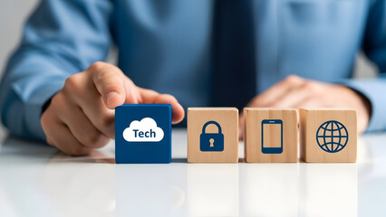 Businessman hand selecting a tech cloud icon from wooden blocks with security and global symbols.