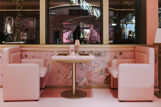 Lanc&ocirc;me 90th anniversary exhibition space featuring a pink-themed beauty counter with cosmetic displays and brand signage inside a retail environment.