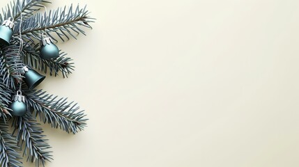 Christmas tree branches with blue ornaments on a beige background