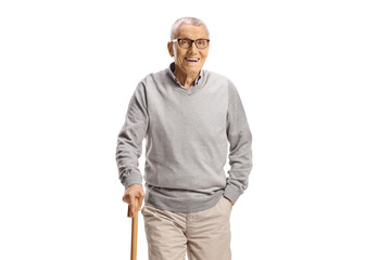 Elderly man with a cane walking towards camera