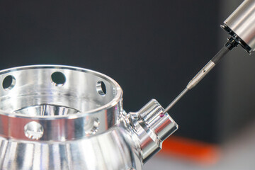 The multi axis CMM machine measuring the aluminum housing parts.