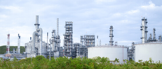 Fototapeta premium Petrochemical Petroleum Refinery Oil and Gas Tank Storage Industrial landscape of power energy industry building