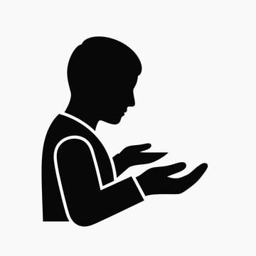 Silhouette of a person in prayer