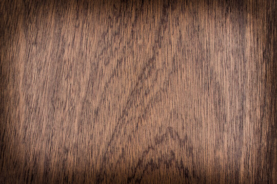 background is made of old wood. an old board. the texture of a rustic table. Sapele, sapelli, sapeli, mahogany, Entandrophragma, red wood, a place for a text or object, frame. the effect of agi