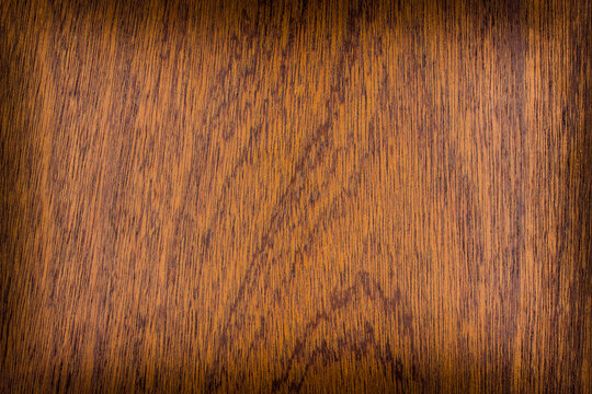 the texture of natural wood. wooden board. the panel is made of natural wood. Sapele, sapelli, sapeli, mahogany, Entandrophragma, red wood, frame, place for text or object, vignetting, horizontal