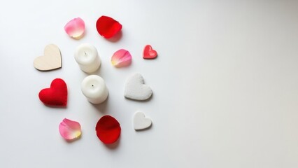 Romantic Heart-Shaped Candles and Flower Petals Arrangement on White Surface