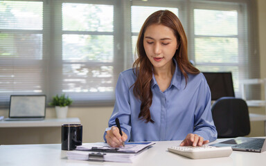 Professional accountant analyzing reports and calculating numbers.