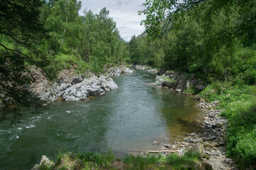 A river runs through a canyon in the mountains	
