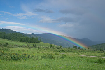 Rainbow after rain in the mountains