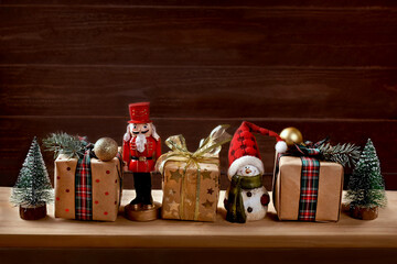 Christmas presents and decors on a wooden shelf