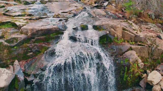 Glendale Falls is a long, powerful waterfall run in the Berkshire hills of western Massachusetts, managed by The Trustees of Reservations. The spring waters of Glendale Brook cascade over approximatel