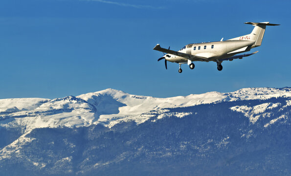 Geneva, Switzerland - november 29, 2025 : sign and logo on a Pilatus PC-12 NGX of Jetfly Aviation landing at Geneva Airport with backdrop of snow covered mountains