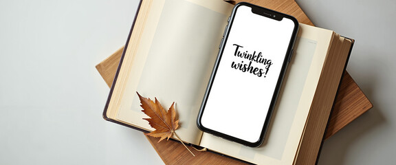 Smartphone lying on stack of books with handwritten holiday message  