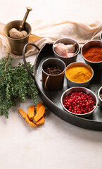 Different aromatic spices in bowls.