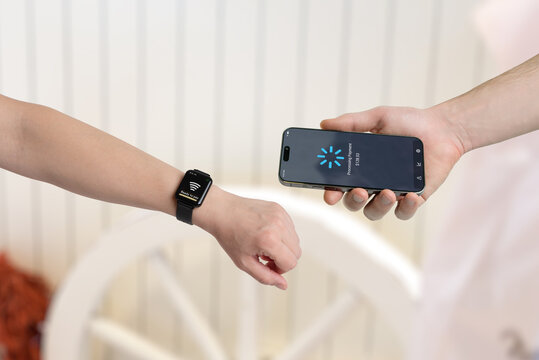 Smartwatch and smartphone contactless payment processing, showing wearable integration and modern digital transaction technology - Powered by Adobe