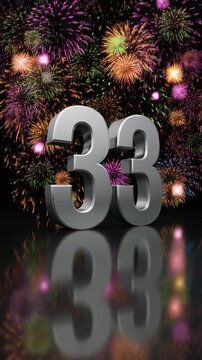 Silver number 33 with fireworks in the background. Festive scene for birthday or anniversary party