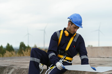 Engineering technicians are working to check the operation of wind turbines in a wind farm and check the electricity.(PHOTO)