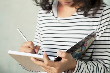 Grl writing a Journal on Clean White Background