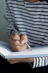 teenager with creative Note Taking a Notebook