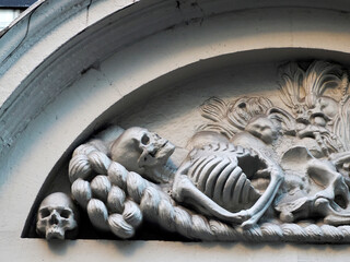 Spes altera vitae skeleton in amsterdam old town buildings detail