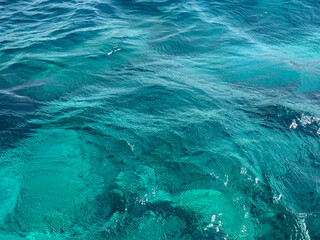Sea waves blue clear water surface.