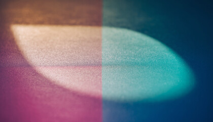 An abstract colorful rainbow background highlights a medical pink and blue vitamin capsule and pharmaceutical pills for healthcare