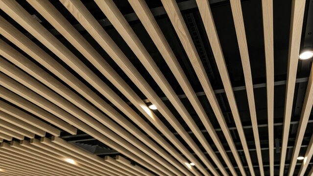 Modern wooden slat ceiling design with recessed lighting in a contemporary interior, looking up.