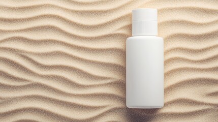 A minimalistic white bottle rests on textured sand, creating a serene and calming visual with soft, wavy patterns.