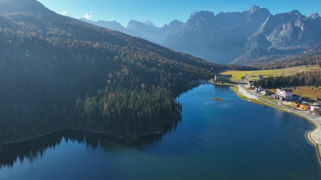 Aerial view of Misurina Lake, Lago di Misurina, in Dolomiti mountains in Italy, drone shot of foggy morning at Misurina lake, hiking in Itay
