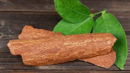 Fresh cinnamon sticks on a wooden background