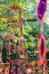 This is a Spider Web Tung, a traditional Lanna flag made of threads, used for religious ceremonies.