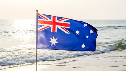 Australian Flag Waving on Sunny Beach with Ocean Waves and Sunlight