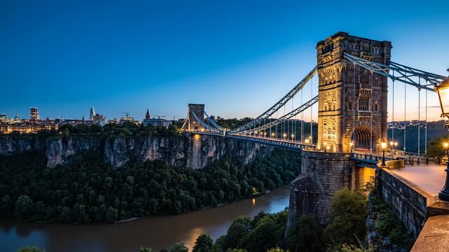 Clifton Suspension Bridge illuminated at twilight spanning the scenic Avon Gorge landmark.
