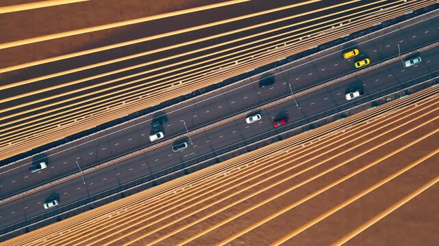 symmetric modern cable-stayed bridge over Chao Phraya river in Bangkok, contemporary suspension urban span over water, aerial drone view, directly above perspective 4k