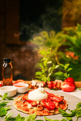 Italian Pizza With Fresh Burrata Cheese, Roasted Tomatoes and Basil Leaves on Wooden Board