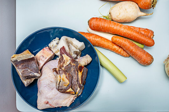  Preparation for meat stew: carrots, potatoes, leeks, and celery with red wine and homemade beef broth