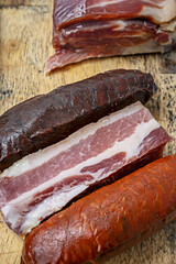 Raw ingredients for beef stew: beef on the bone, carrots 8. Ingredients for lamb stew: baby potatoes, frozen peas, tomato paste, and white wine