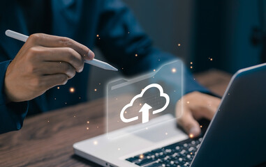 A professional uses a stylus to manage cloud files on a laptop, representing cloud file management, digital storage, secure access, productivity tools, and modern business workflows.