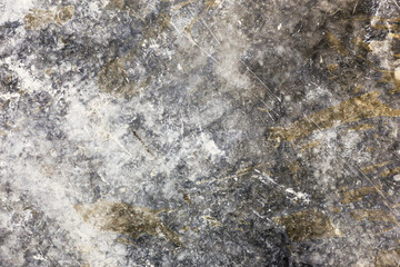 Natural stone surface texture. Rough rock background detail. Gray mineral pattern closeup. Weathered stone slab surface. Abstract geological structure. Solid rock material background.